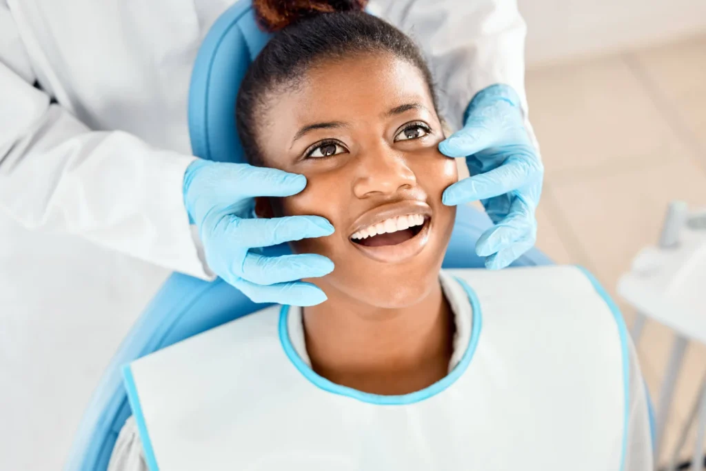 dentist in miramar fl checking patient's teeth
