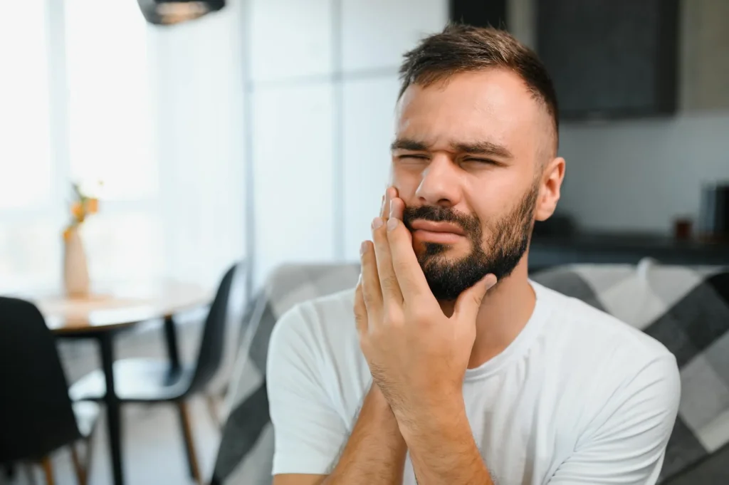 man seeing an emergency dentist sunrise