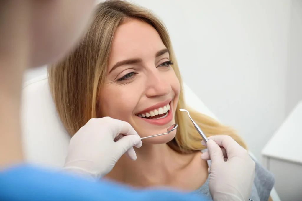 patient having a routine exam with her dentist in miramar fl