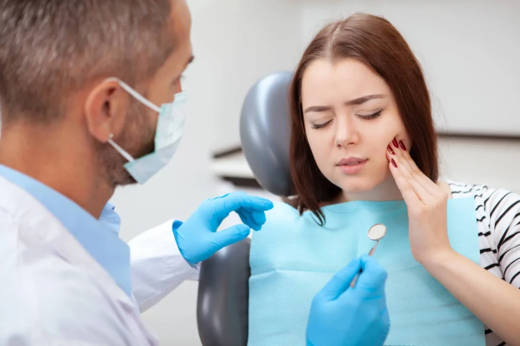 patient talking to an emergency dentist sunrise