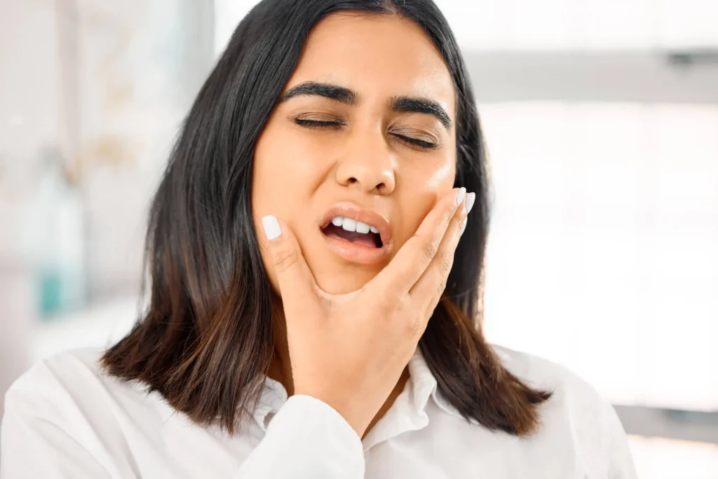 woman in pain needs an emergency dentist sunrise fl