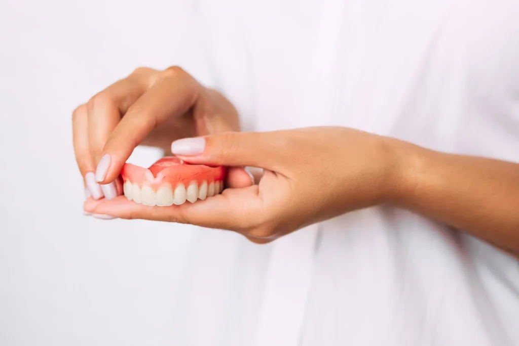 dentist-miramar-fl-holding-dentures