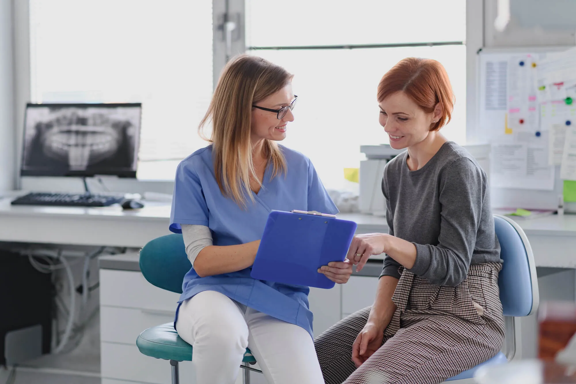 dentist miramar discussing with patient