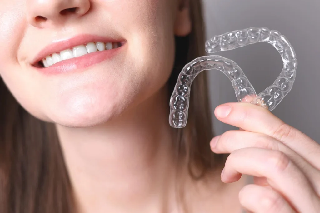 woman holding invisalign pembroke pines